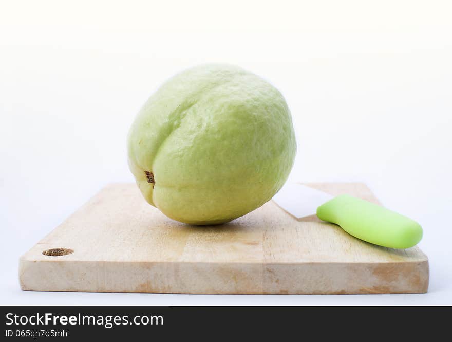 Guava fruit on chopping board with clean white background