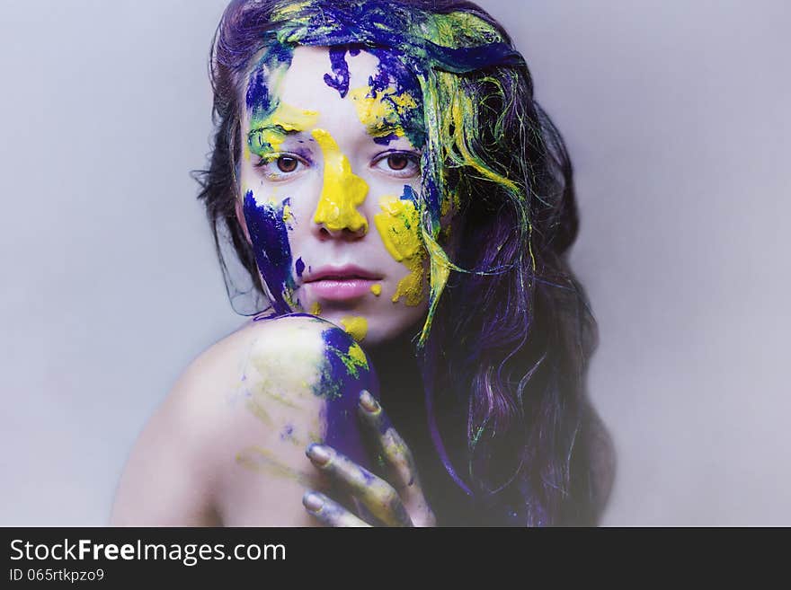 Beauty Portrait Of Girl Painted Blue And Yellow