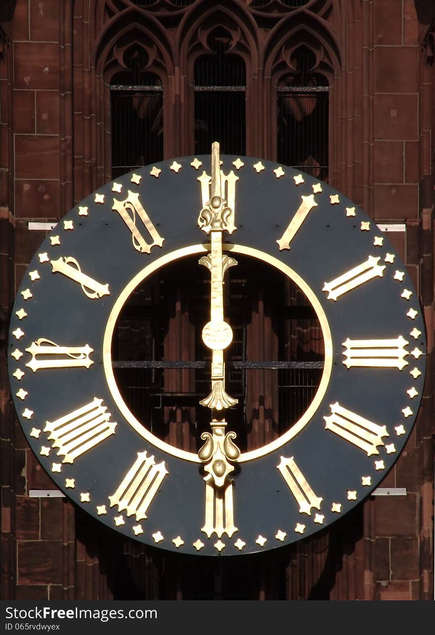 Old clock with Roman numerals on a church tower. Old clock with Roman numerals on a church tower