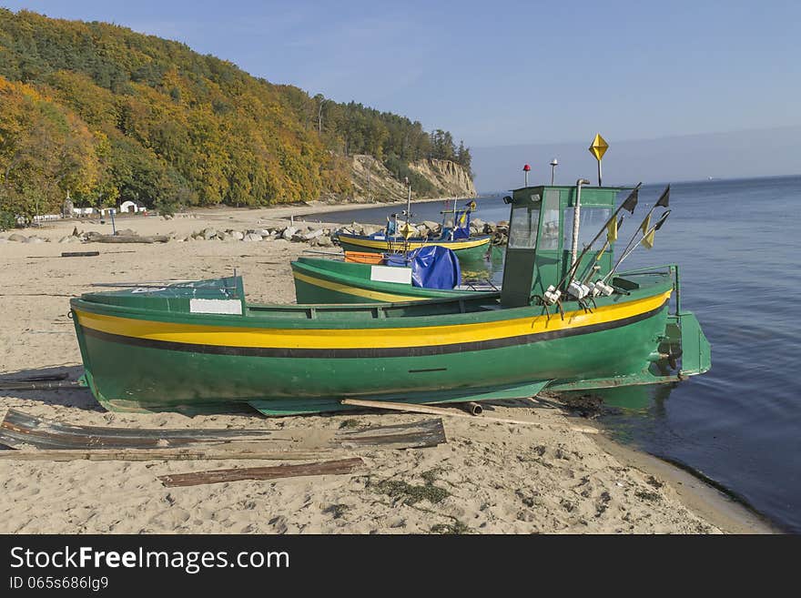 Small fishing boat on shore of the Baltic Sea in Gdynia, Poland. Small fishing boat on shore of the Baltic Sea in Gdynia, Poland