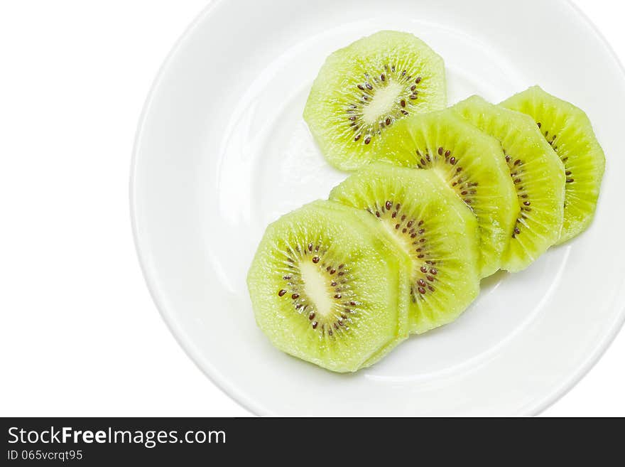 Kiwi fruits on white plate