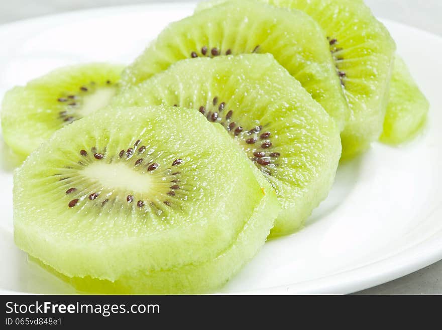 Kiwi fruits on white plate