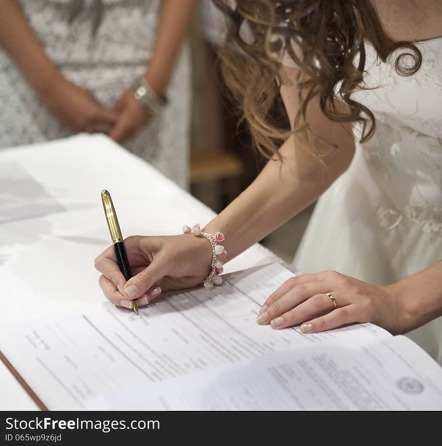 Bride signing the wedding in church. Bride signing the wedding in church