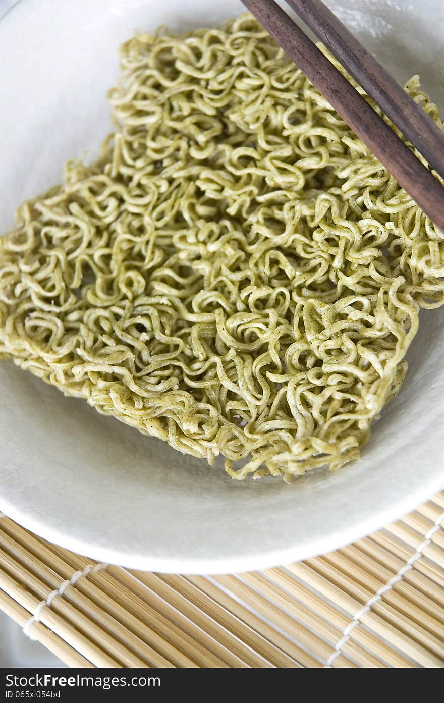 Green instant noodle in bowl