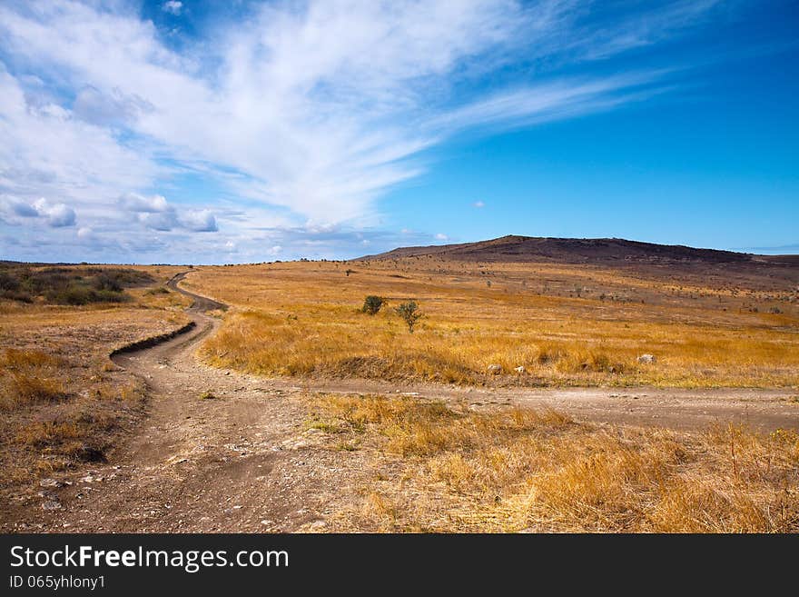 Beautiful sky above dirt road in the field. Beautiful sky above dirt road in the field