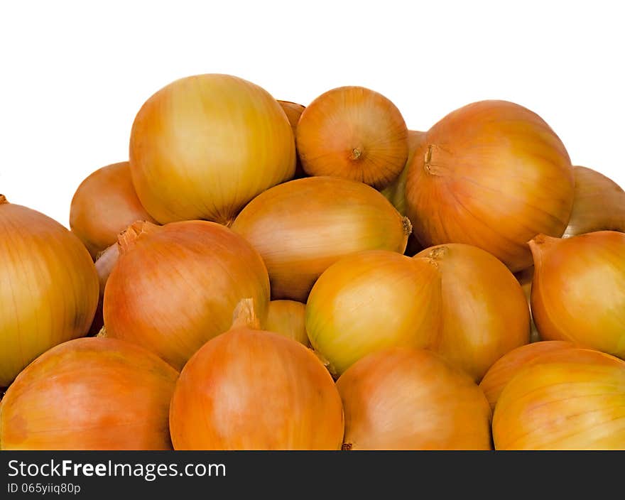 Many large onions onions are on the table. Presented on a white background. Many large onions onions are on the table. Presented on a white background.