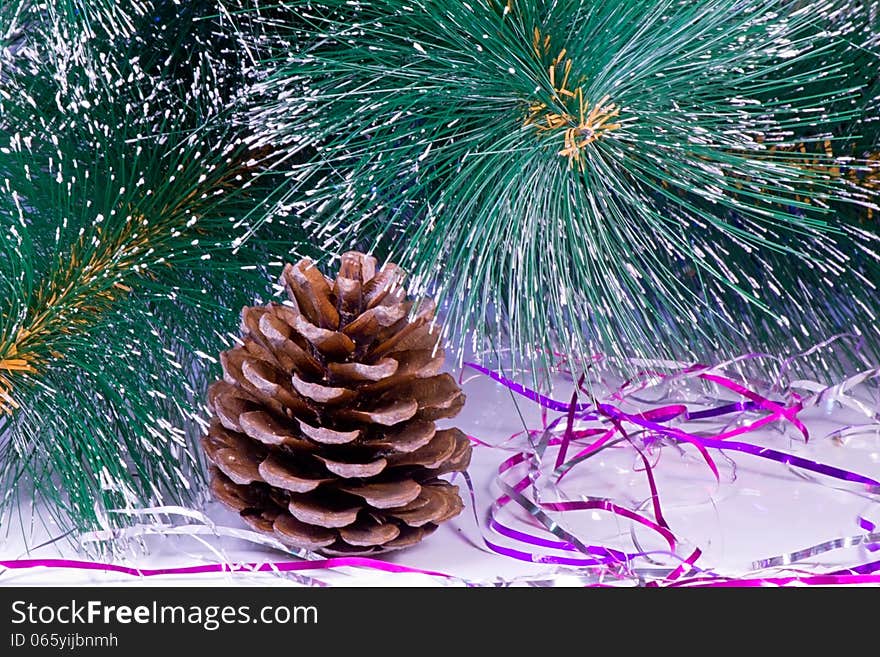 Decoration for the Christmas tree is a pine cone.