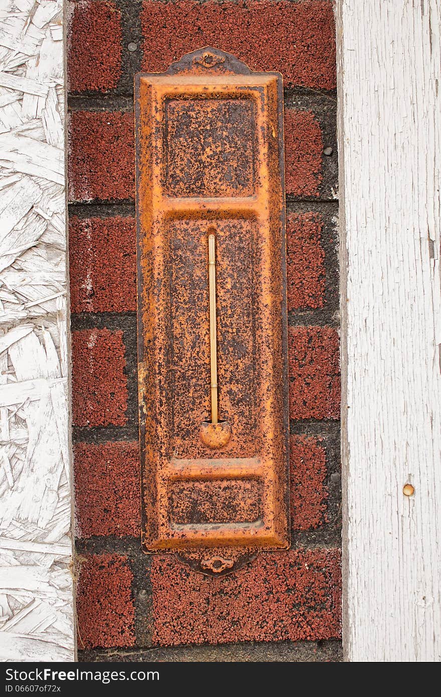 An old rusted thermometer