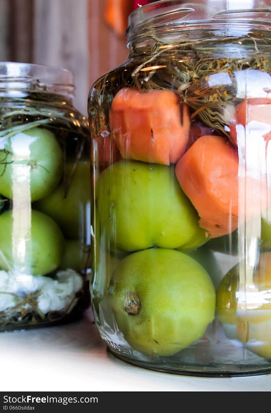 Jars with red white green homemade pickles