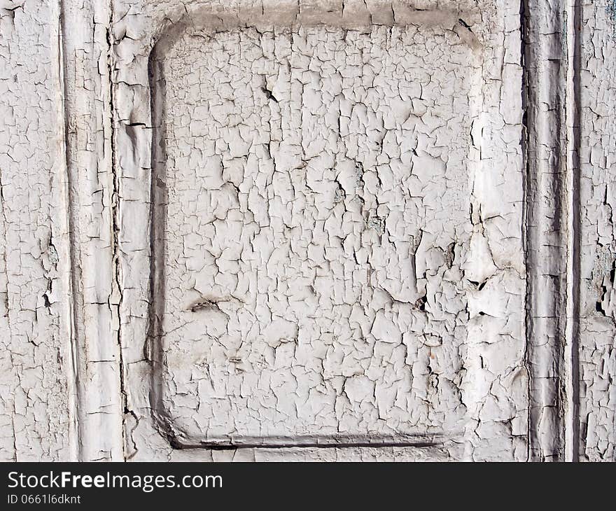 Detail of a peeling painted wooden door. Detail of a peeling painted wooden door