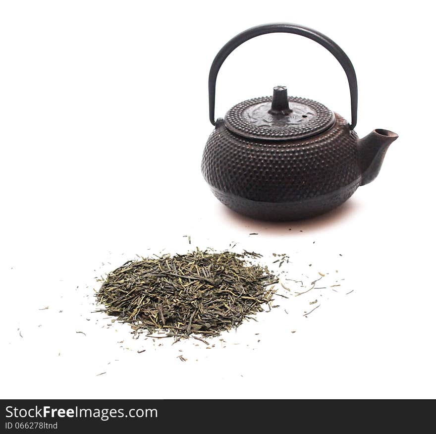 Green tea and a black japanese teapot