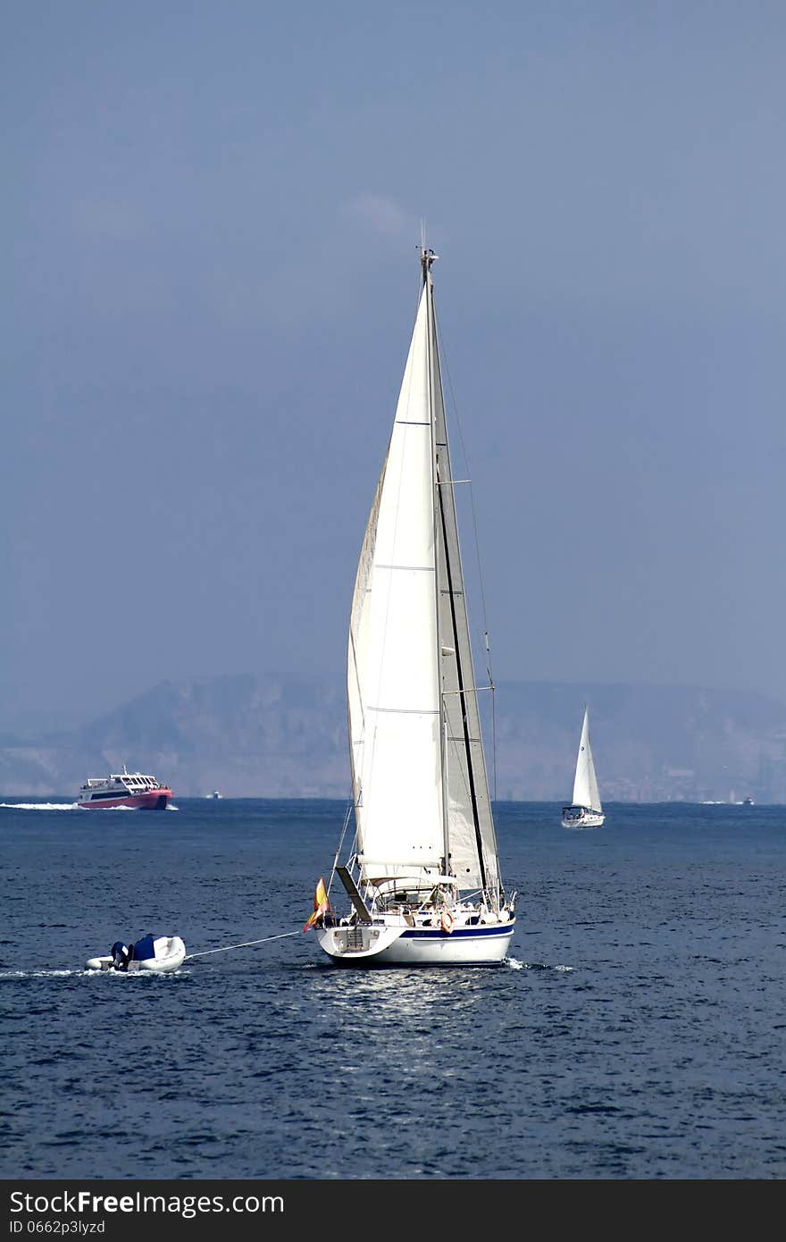 Sloop sailing in open waters. Sloop sailing in open waters