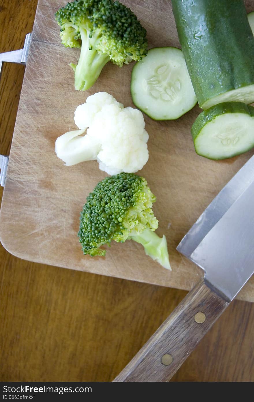 Vegetables With Knife On Cutting Board