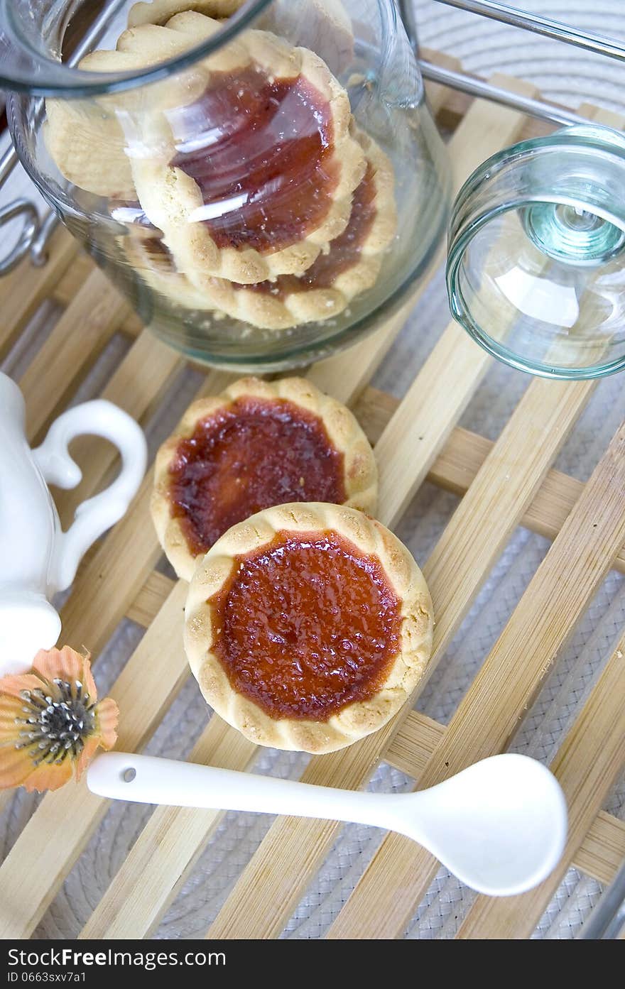 Open cookies jar on wooden tray