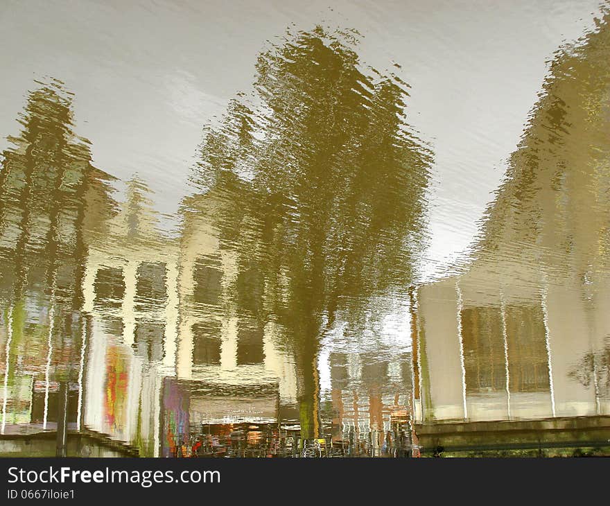 A typical Amsterdam series of building reflected on the calm water of a canal. Image is rotated by 180 degrees. A typical Amsterdam series of building reflected on the calm water of a canal. Image is rotated by 180 degrees.