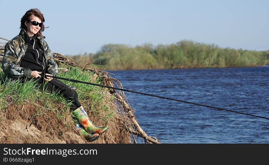 woman fishing on the Bank of the river. woman fishing on the Bank of the river