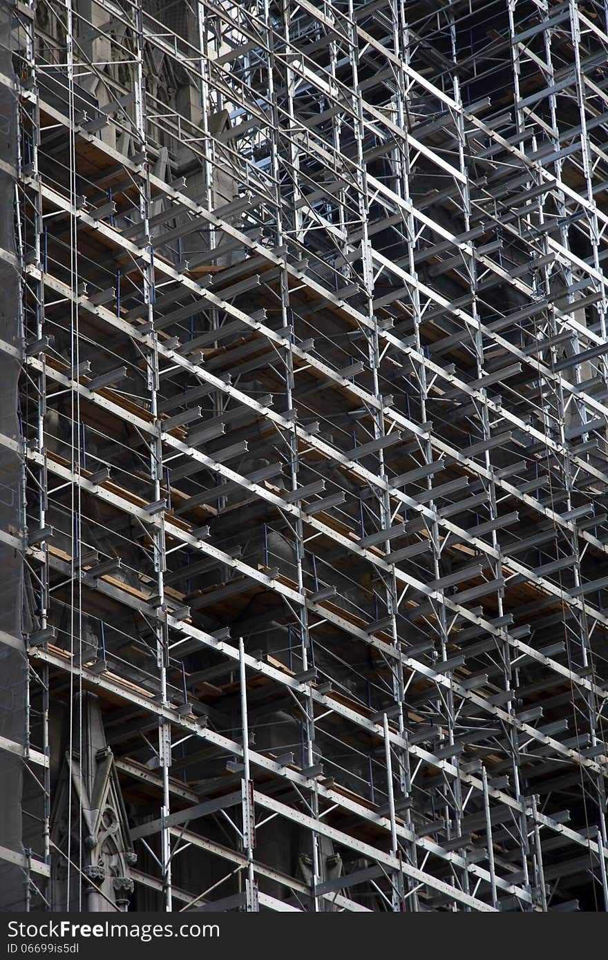 Extensive scaffolding in place in construction works in city. Extensive scaffolding in place in construction works in city