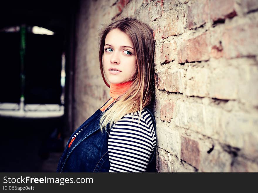 Portrait of attractive girl outdoor near old building