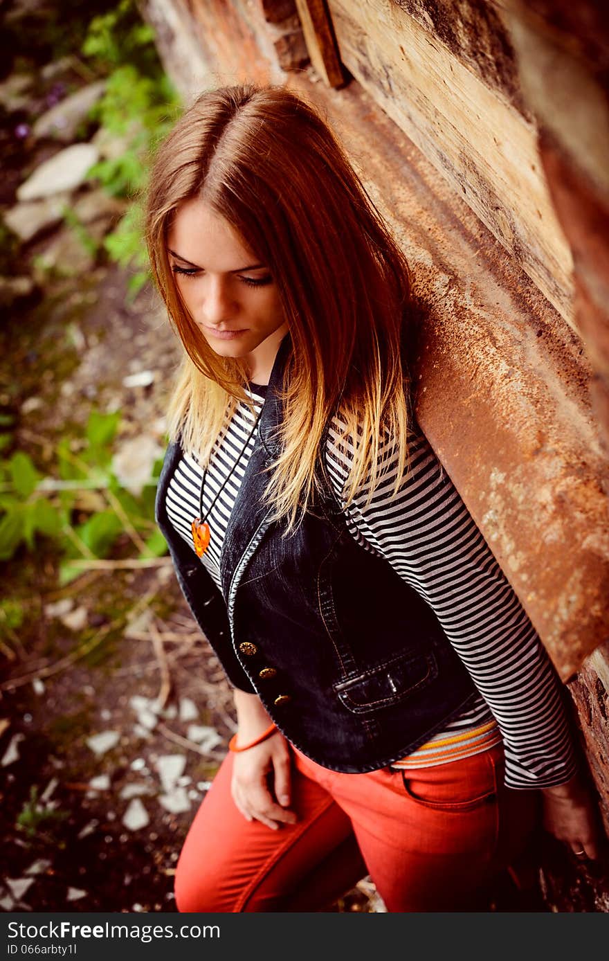 Portrait of attractive girl outdoor near old building