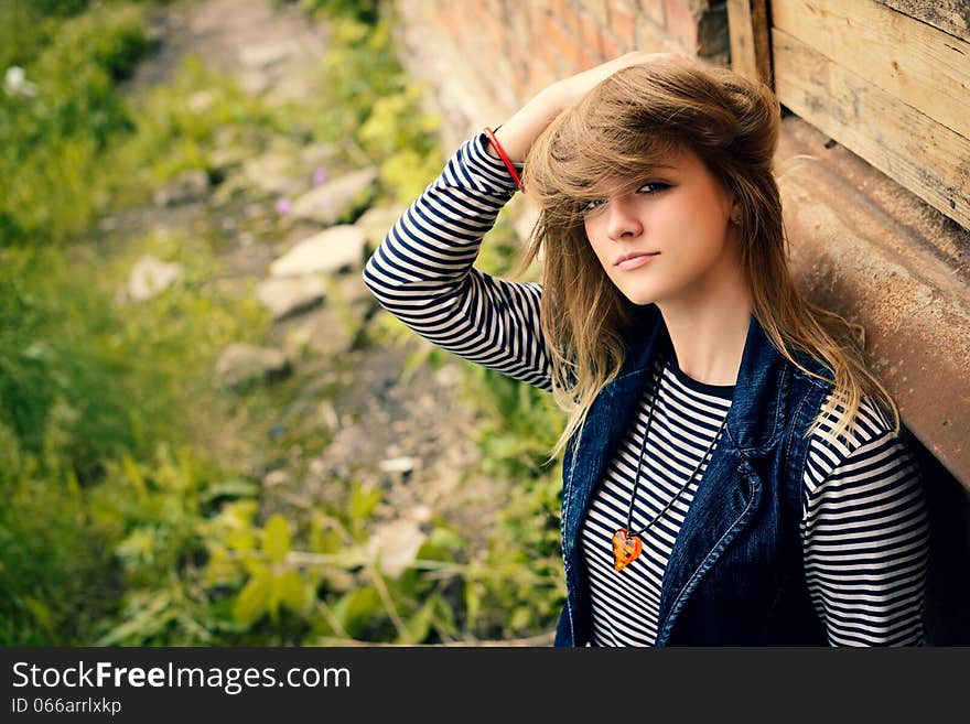 Portrait of attractive girl outdoor near old building