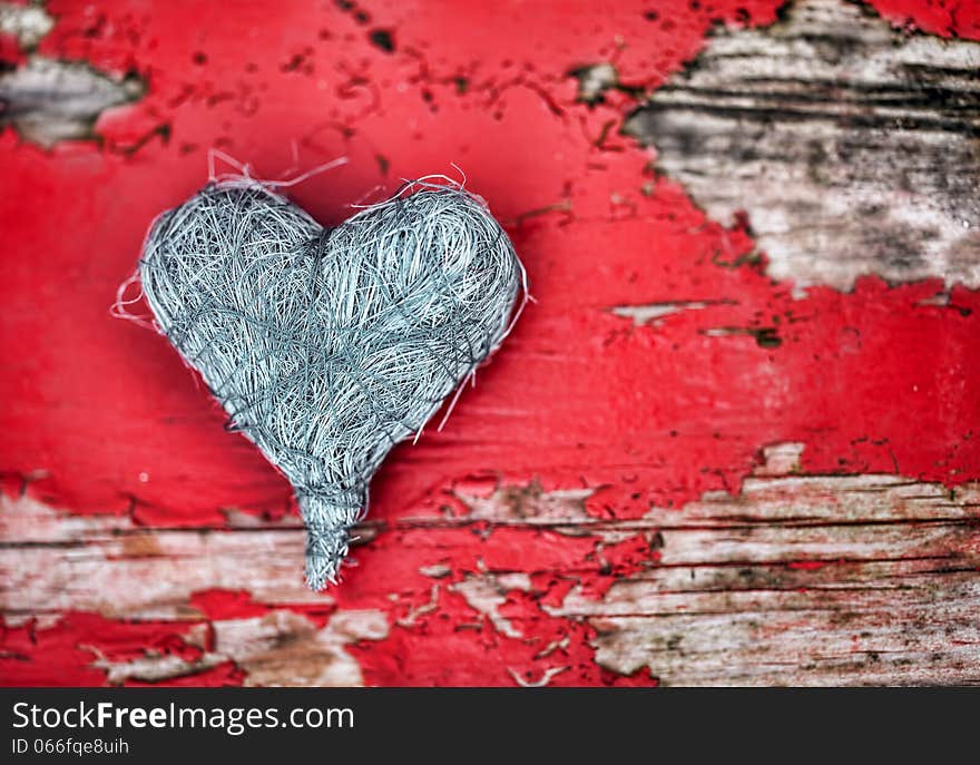 Grey heart on red wooden background. Grey heart on red wooden background