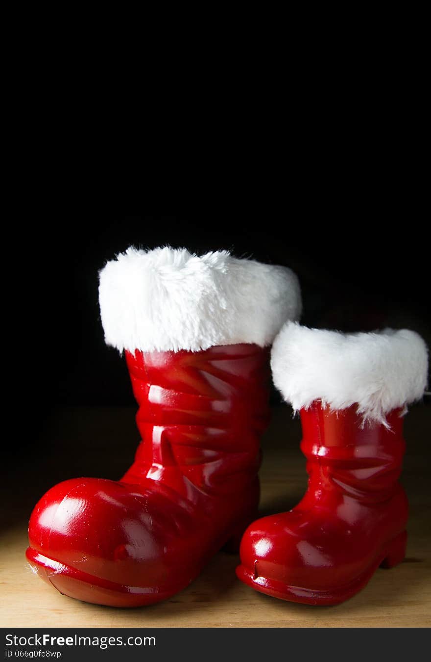 Red Santa boot on black background