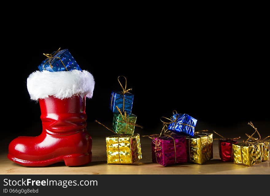 Red Santa boot on black background