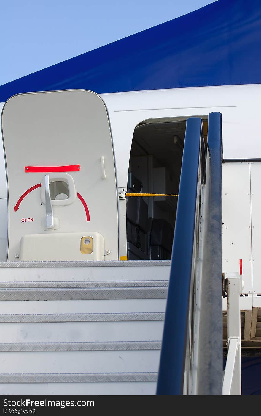 Passenger boarding stairs with open door