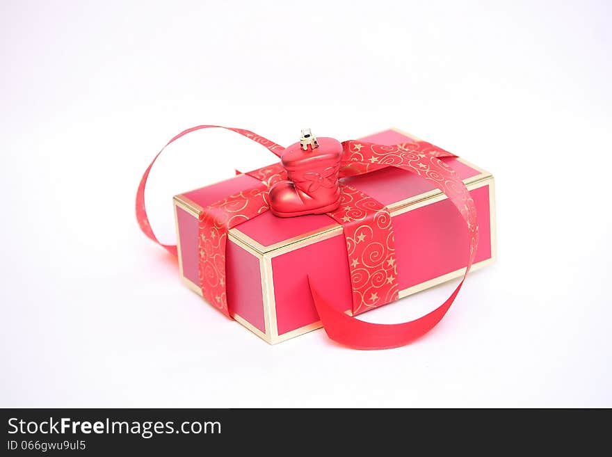 Red Christmas gift box on white background.