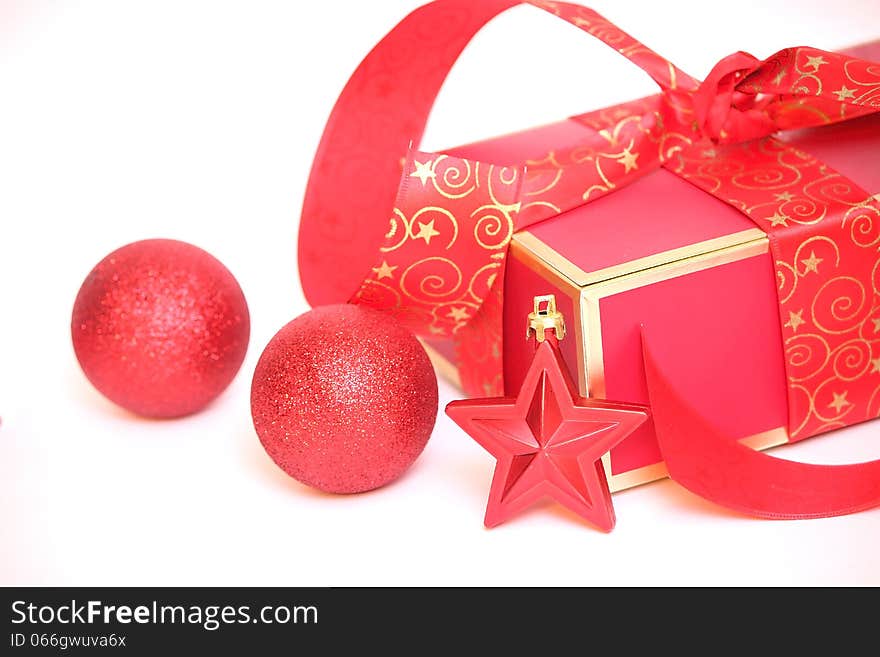 Red Christmas gift box, Cristmas star on white background.