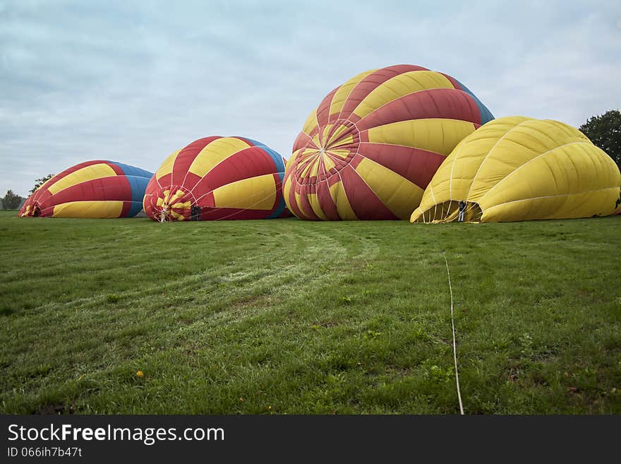 Preparing hot air balloons in the early morning