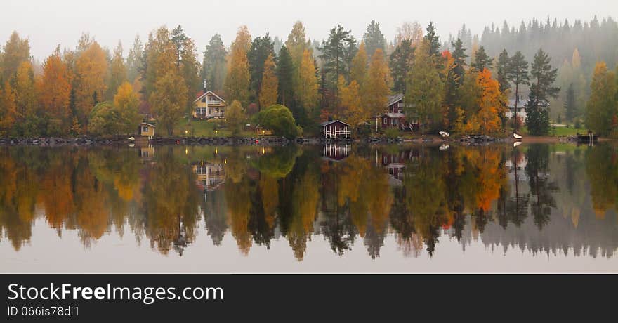 Autumn lake with trees mirroring. Autumn lake with trees mirroring