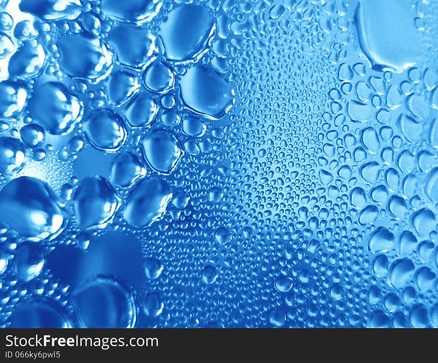 Condensate of water on a blue background. Condensate of water on a blue background