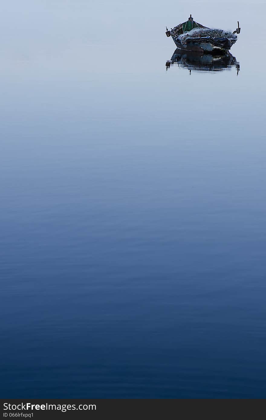 Fishing boat in calm lagoon and the blue bay. Fishing boat in calm lagoon and the blue bay.