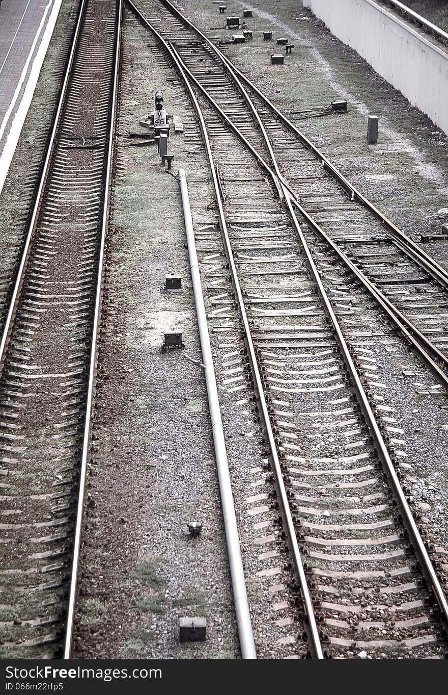 Railway texture background. Railroad - transport landscape with lines of rails. Perspective way on forward railway. Railway texture background. Railroad - transport landscape with lines of rails. Perspective way on forward railway.