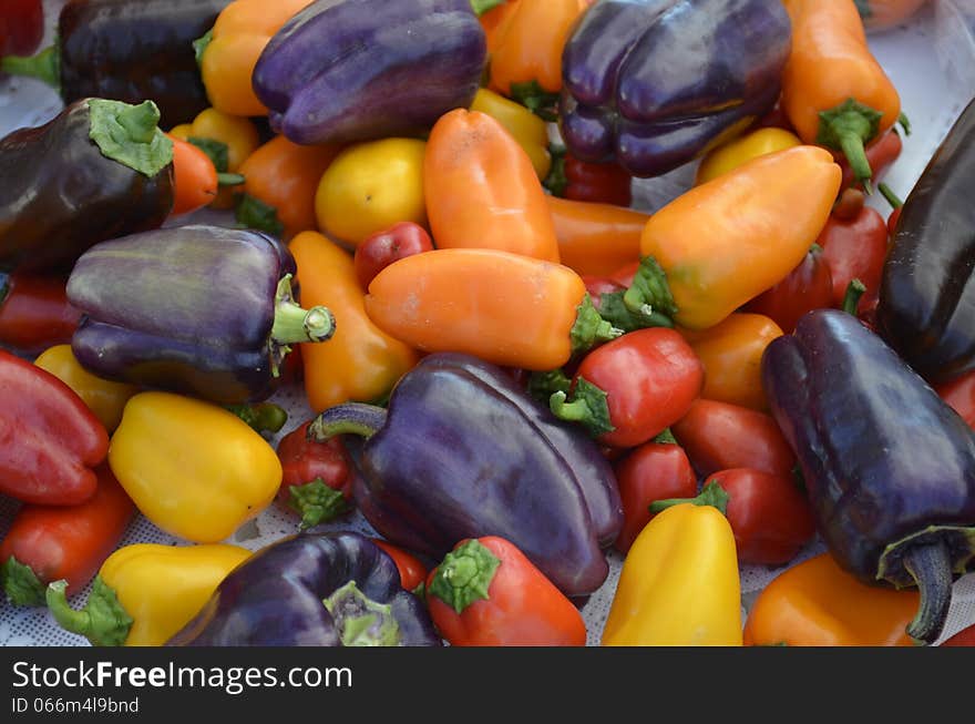 Colorful peppers for sale at a local outdoor food market in rural Michigan, USA