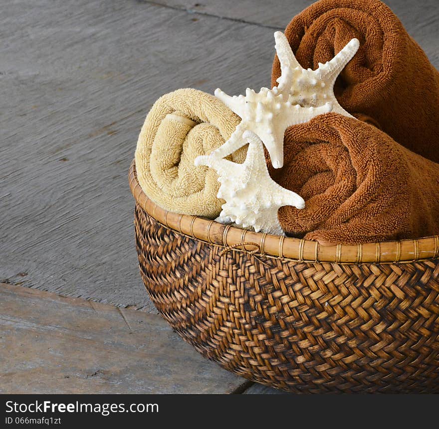 Basket with 3 towel with starfish as decoration. Basket with 3 towel with starfish as decoration