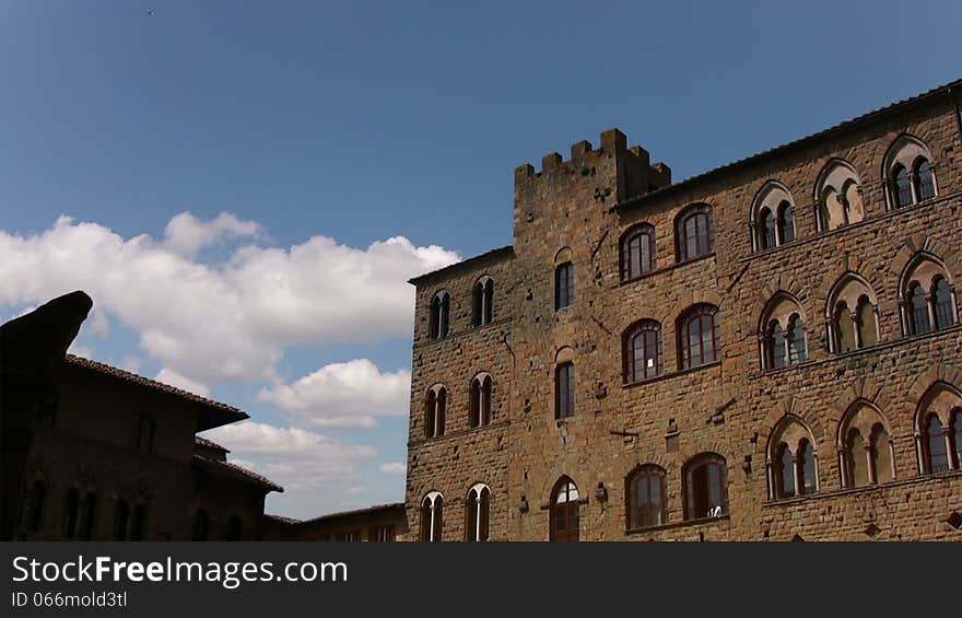 Europe. Italy. Pitigliano. View of the old building and the clouds that run quickly through the blue sky. Europe. Italy. Pitigliano. View of the old building and the clouds that run quickly through the blue sky