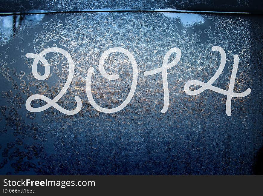 2014 on the frozen surface of the window. 2014 on the frozen surface of the window