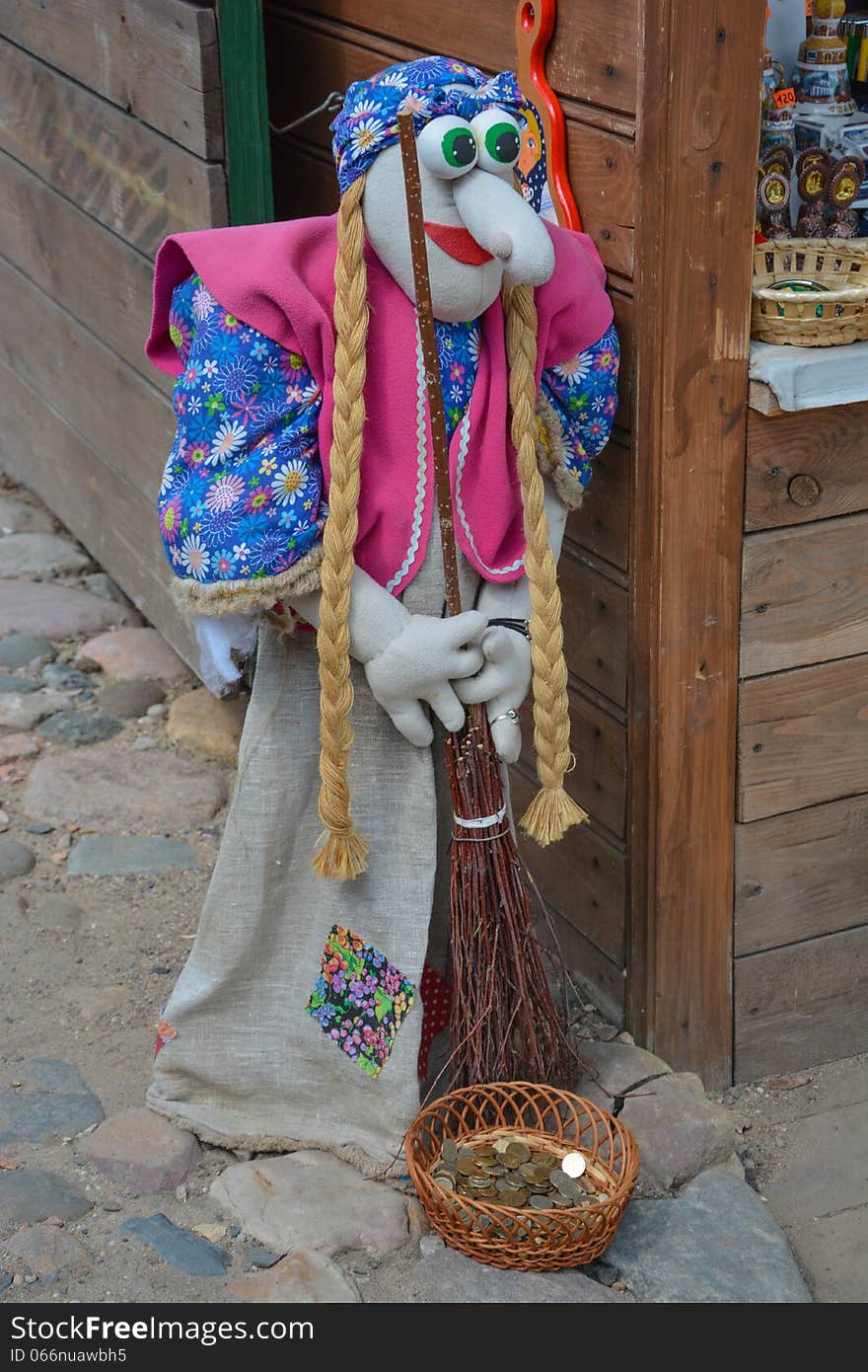 Beautiful doll Baba-Yaga is on the corner and asking for alms. Beautiful doll Baba-Yaga is on the corner and asking for alms.