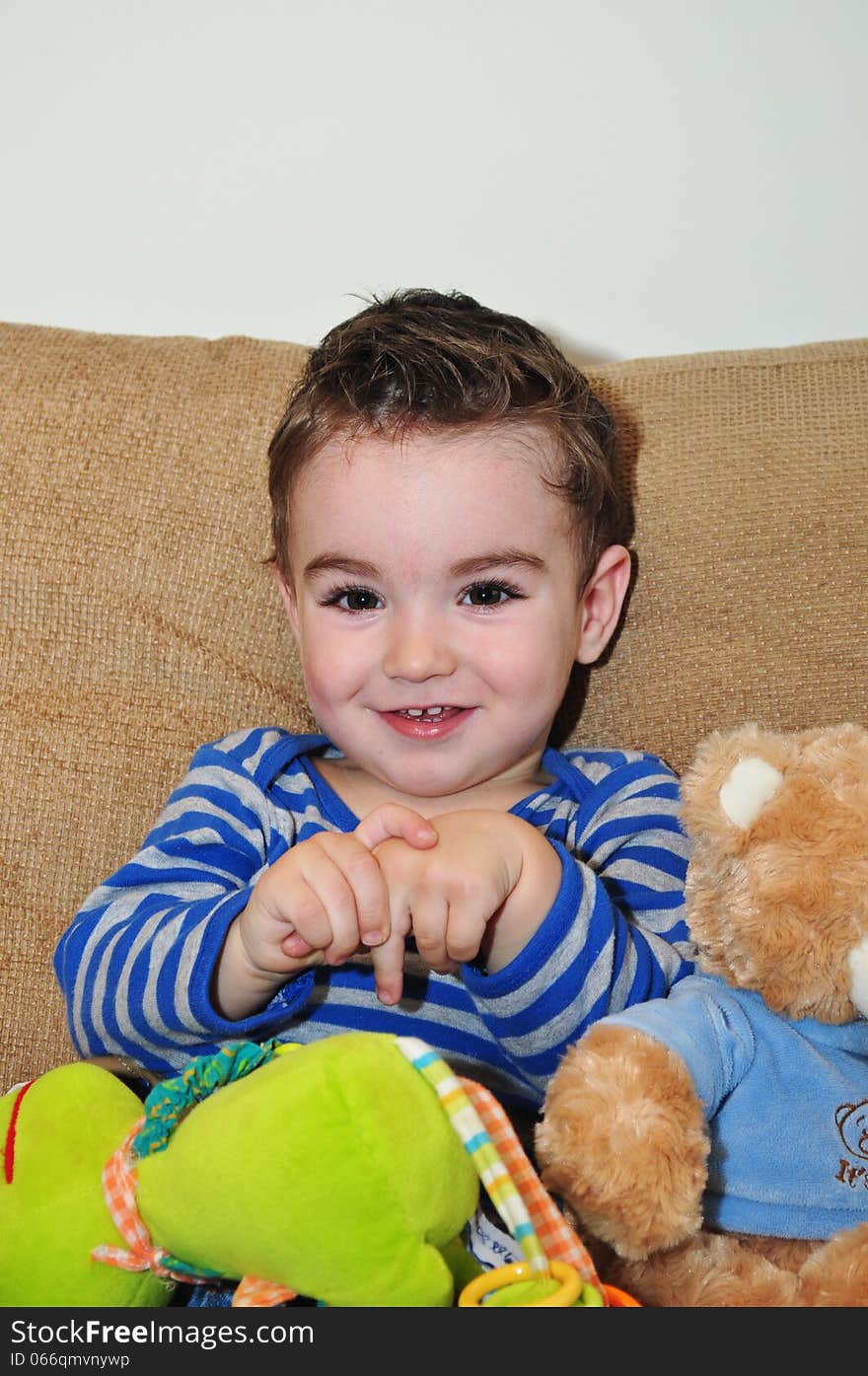 A portrait of a happy baby boy playing with toys. A portrait of a happy baby boy playing with toys.