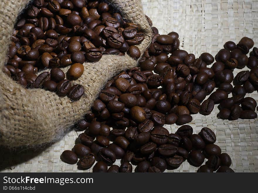 Spill Robusta Coffee Beans on Goni Sack