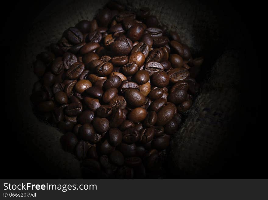 Spill Robusta Coffee Beans on Goni Sack