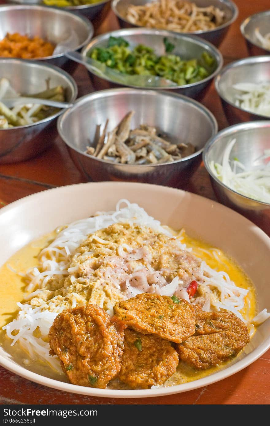 'Kanom jeen' thai rice noodles serves with fish curry and Phuket fish ball