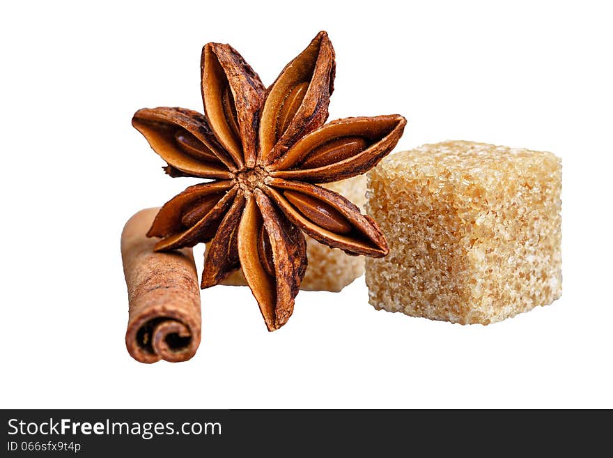 Still life of cinnamon, star anise and sugar cubes isolated on white background. Still life of cinnamon, star anise and sugar cubes isolated on white background