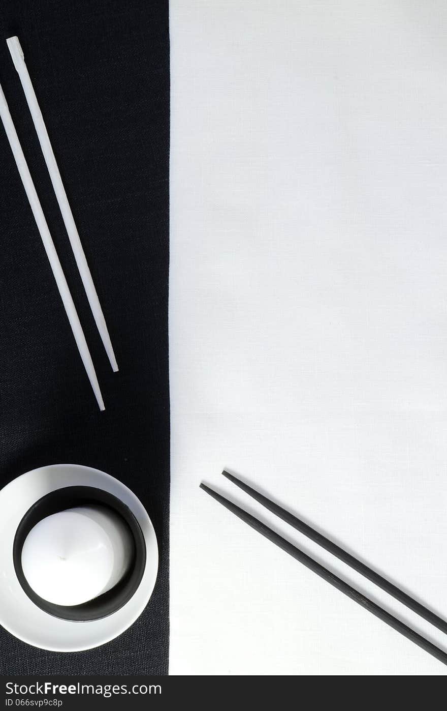 White porcelain on black and white linen tablecloths. White porcelain on black and white linen tablecloths. Abstract still life. From series Playing with Color