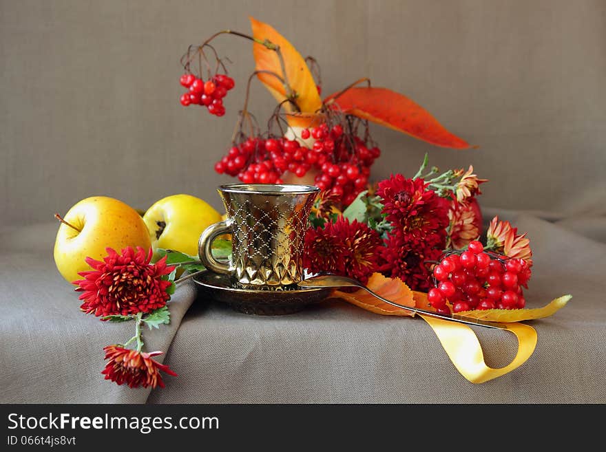 A cup of coffee and autumn flowers