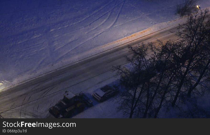 Town winter night, snowy road