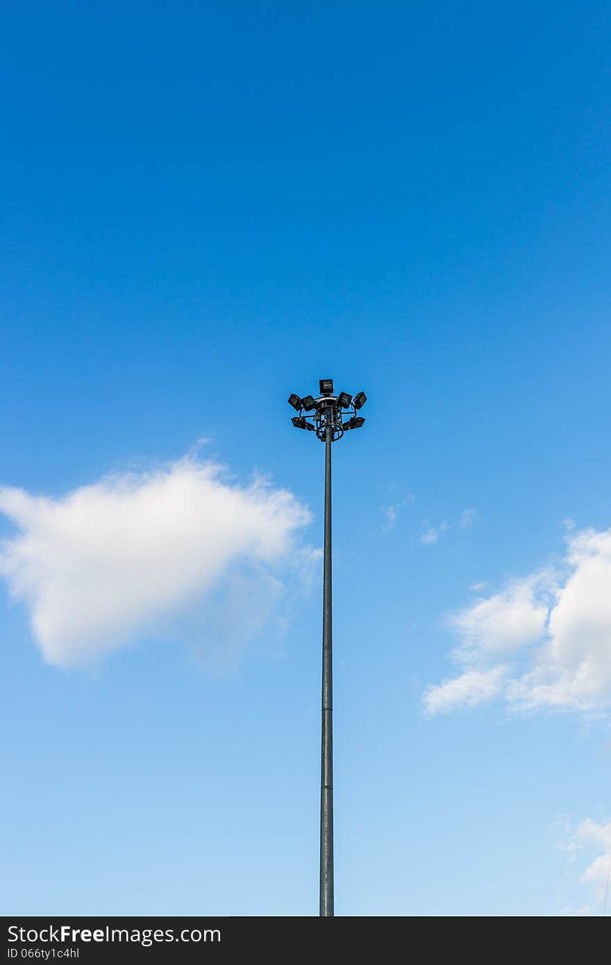 Street light towers on blue sky. Street light towers on blue sky