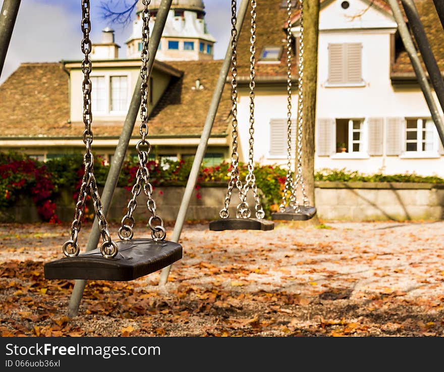 Swings in the park on an autumn day. Swings in the park on an autumn day